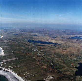 General oblique aerial view looking across the crofting townships of South Boisdale and North Boisdale towards Beinn Mhor in the distance, taken from the SW.