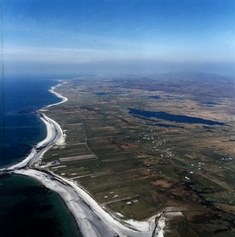 General oblique aerial view looking along the coast of South Uist across the machair and the crofting townships of South Boisdale and North Boisdale, taken from the S.