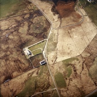 Oblique aerial view centred on the church and manse, taken from the NE.