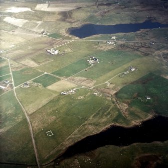 Oblique aerial view centred on the crofting township and remains of the buildings, taken from the WSW.