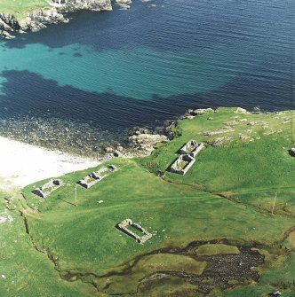 Oblique aerial view centred on the remains of the fishing station, taken from the W.