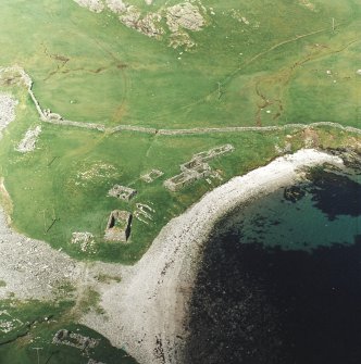 Oblique aerial view centred on the remains of the fishing station and prehistoric house, taken from the S.