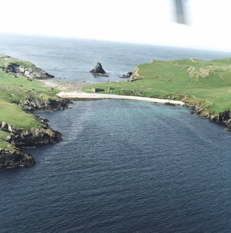 General oblique aerial view centred on the remains of the fishing station and prehistoric house, taken from the SE.
