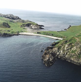 General oblique aerial view centred on the remains of the fishing station and prehistoric house, taken from the E.