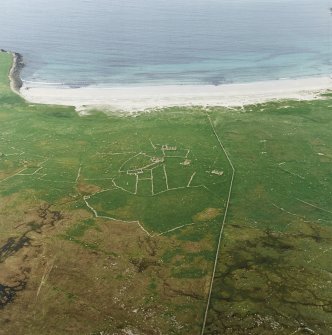 Oblique aerial view centred on the remains of the township and head-dyke, with the remains of the Viking settlement adjacent, taken from the WSW.