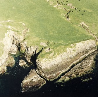 Aerial view of Orkney, Yesnaby taken from the NW, of the Broch of Borwick.  Also visible is a small area of rig-and -furrow cultivation.