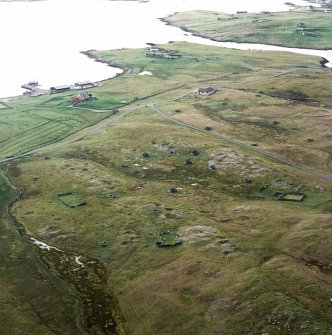 General oblique aerial view of the remains of the planticrubs, enclosures, building and quarries, taken from the SE.