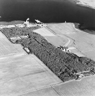 Oblique aerial view of Orkney, Shapinsay, Balfour Castle, Balfour village and harbour taken from the WNW.  Also visible is the Dishan Tower dovecot.