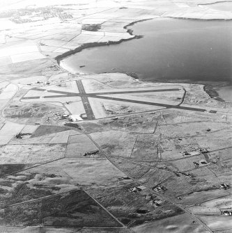 Oblique aerial view of Orkney, Kirkwall Airport, general view taken from the SE.