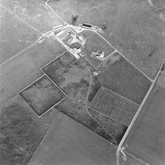 Oblique aerial view of Sanday, Warsetter Farmhouse and Dovecot with the PO Radio Station from the SW.