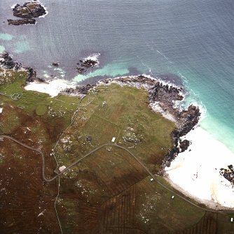 Oblique aerial view centred on the remains of the township and lazy beds with the remains of the radar station and possible nunnery adjacent, taken from the NE.