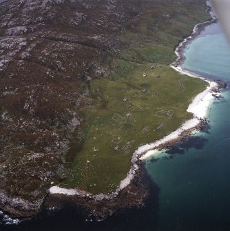 Oblique aerial view centred on the remains of the township with the mission house adjacent, taken from the SSE.