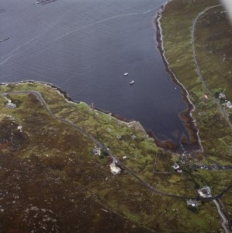 Oblique aerial view centred on the remains of the whaling station with the remains of the township adjacent, taken from the NE.