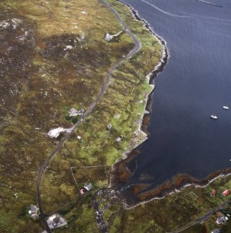 Oblique aerial view centred on the remains of the whaling station with the remains of the township adjacent, taken from the NNW.