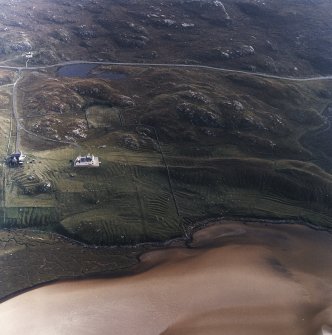 Oblique aerial view centred on the shooting lodge and lazy beds with the cottage and kennels adjacent, taken from the SSE.