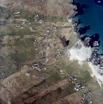 Oblique aerial view centred on the townships and the remains of the buildings, taken from the SSE.