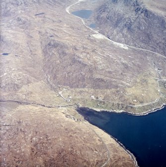 General oblique aerial view centred on the township with the quarry adjacent, taken from the WSW.
