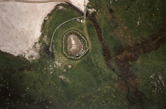 Oblique aerial view centred on the reconstructed house, taken from the SW.