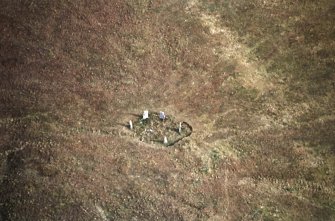 Oblique aerial view centred on the remains of the stone circle, taken from the WSW.