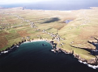 General oblique aerial view looking across the harbour, crofting township and lazy beds towards the townships, taken from the ESE.