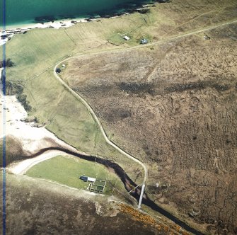 Oblique aerial view centred on the farmsteadings and remains of the field banks and rig, taken from the WNW.