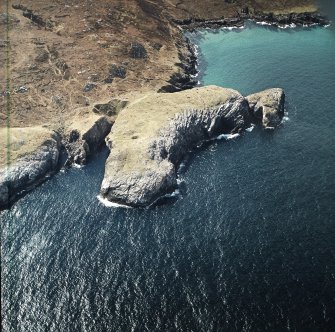 Oblique aerial view centred on the remains of the fort, taken from the NE.