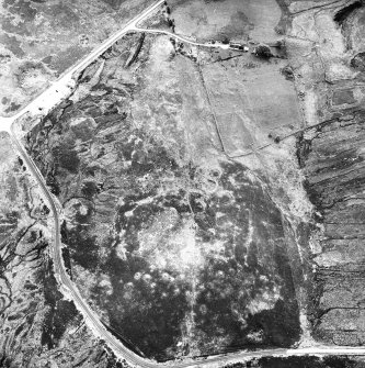 Dremergid, oblique aerial view, taken from the N, centred on an area defined as an archaeological landscape, and burnt mounds. In the upper right-hand corner a building with stack stands and possible clamp-kilns are visible.