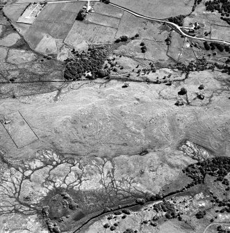 Little Rogart, oblique aerial view, taken from the WNW, showing an area defined as an archaeological landscape.