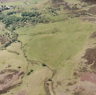 Morvich Burn, oblique aerial view, taken from the NE, centred on a township. Sheepfolds are visible in the centre left-hand side of the photograph.