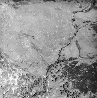 Morvich Burn, oblique aerial view, taken from the SE, centred on a township. Sheepfolds are visible in the bottom right-hand corner of the photograph.