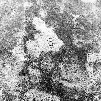 Oblique aerial view centred on the remains of the hut-circle and field system, taken from the SE.