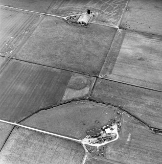 Carin of Humster, oblique aerial view, taken from the NE, showing the remains of a broch in the centre of the photograph.