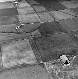 Carin of Humster, oblique aerial view, taken from the SW, showing the remains of a broch in the centre of the photograph.