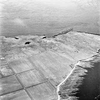 Stroma, oblique aerial view, taken from the E, showing Nethertown township in the centre of the photograph.