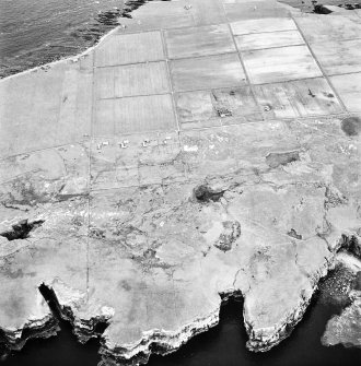 Stroma, oblique aerial view, taken from the WNW, showing Nethertown township in the centre of the photograph.