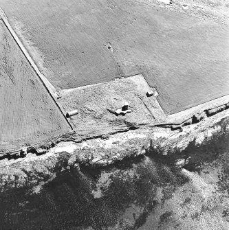 Oblique aerial view of Orkney, Burray, Second World War Northfield coast battery and the Broch of Burray taken from the N.