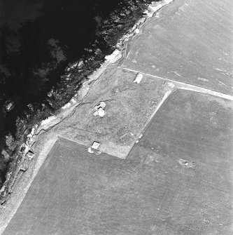 Oblique aerial view of Orkney, Burray, Second World War Northfield coastal battery and the Broch of Burray taken from the W.