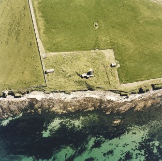 Oblique aerial view of Orkney, Burray, Second World War Northfield coastal battery and the Broch of Burray taken from the N.