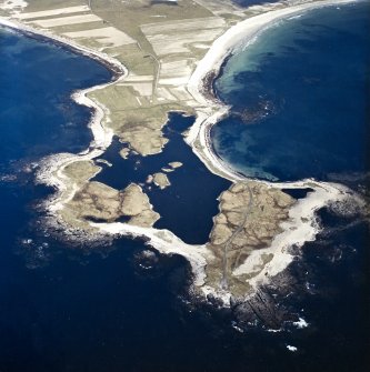 General oblique aerial view looking over Rubhe Ardvule, with the remains of the bothies, kelp kilns and the dun adjacent, taken from the WNW.