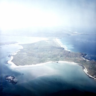 General oblique aerial view looking across Eolaigearraidh towards Sheabhal in the distance, taken from the NE.