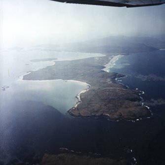 General oblique aerial view looking across Eolaigearraidh towards Sheabhal in the distance, taken from the NNE.