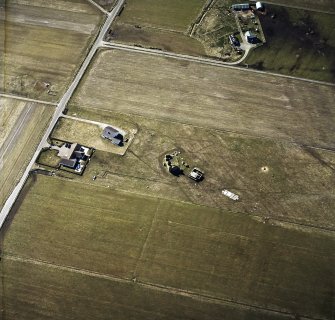 Oblique aerial view centred on the remains of the castle with the remains of the radar station adjacent, taken from the E.