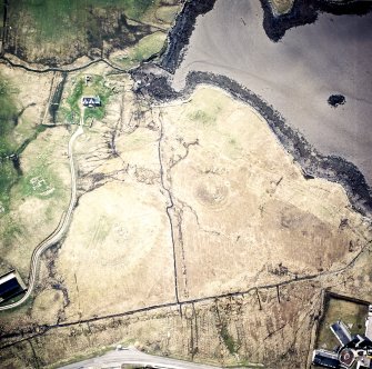 Oblique aerial view centred on the remains of the cairns, taken from the ENE.