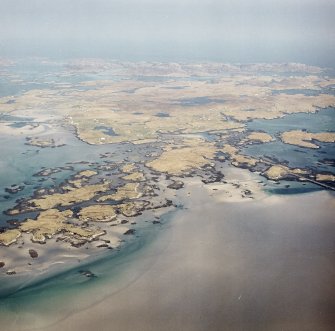 General oblique aerial view centred on the island of Grimsay with peat cutting in the foreground, taken from the W.