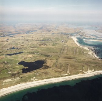 General oblique aerial view looking across Benbecula, with the crofting townships in the foreground, taken from the W.