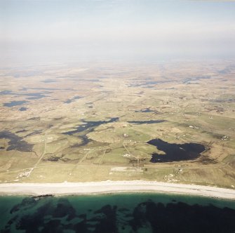 General oblique aerial view looking across Benbecula, with the crofting townships in the foreground, taken from the W.