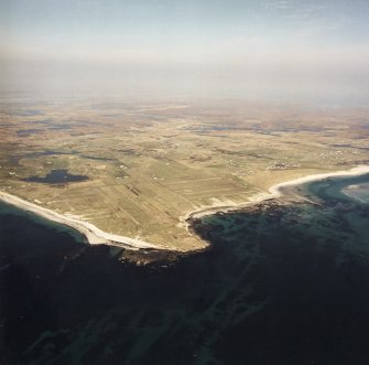 General oblique aerial view looking across Benbecula, with the crofting townships in the foreground, taken from the SW.