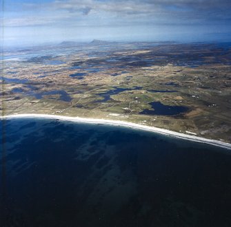 General oblique aerial view over the Isle of Benbecula with Eaval and Ronay in the distance, taken from the SW.