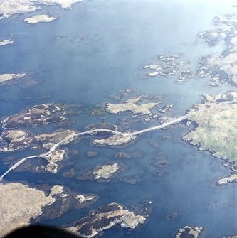 Oblique aerial view centred on the causeway (NF 8424 4653), taken from the SW.