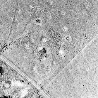 Oblique aerial view of Upperton centred on the remains of hut-circles and a field-system, taken from the WSW.